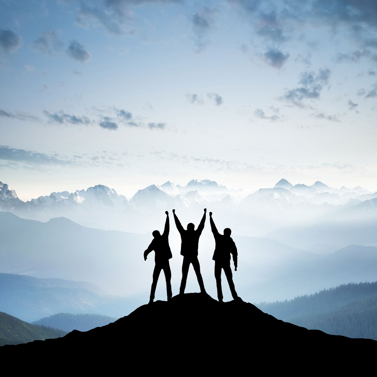 Hikers standing on a mountain.